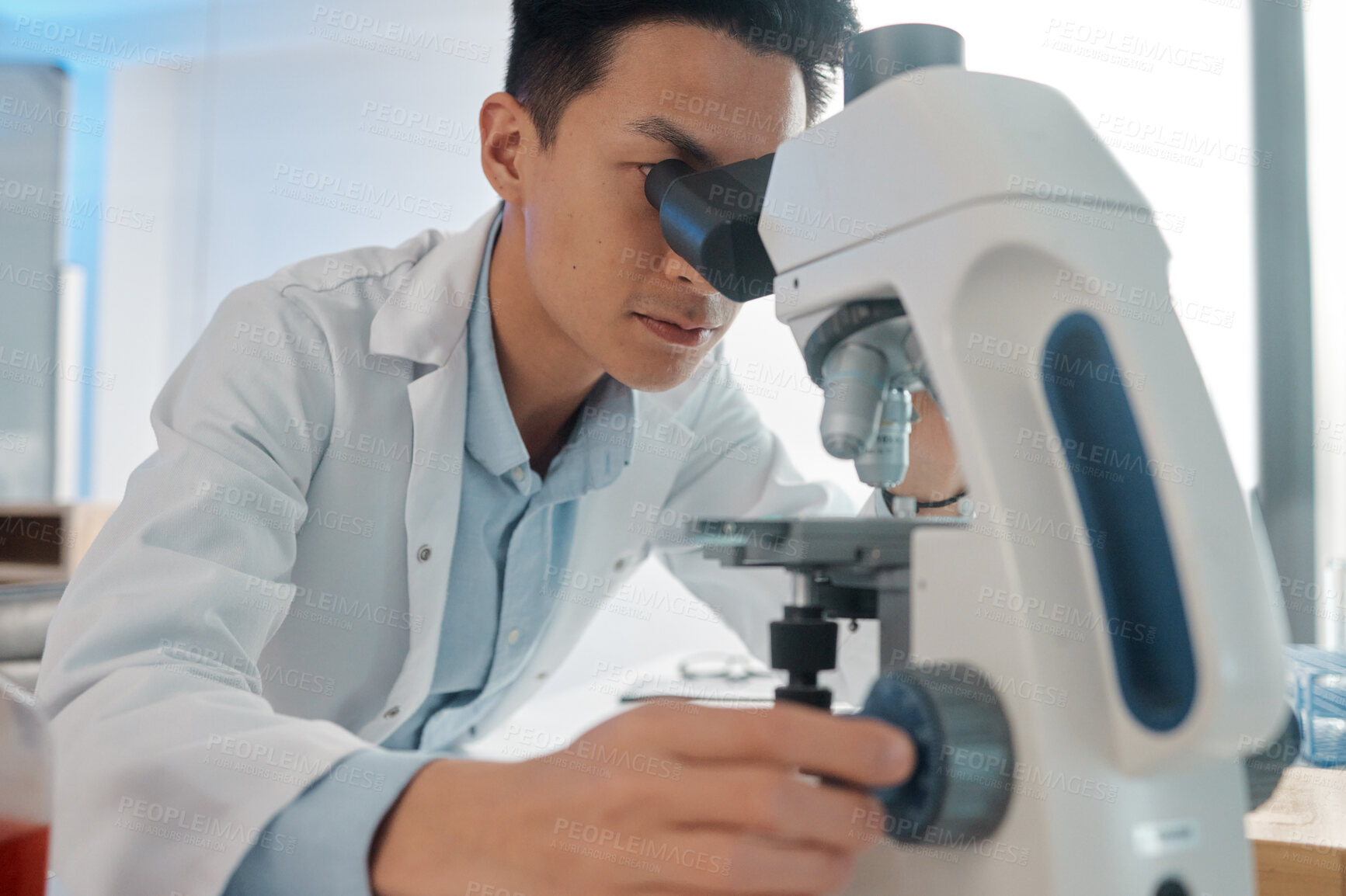 Buy stock photo Man, scientist and microscope at laboratory for scientific research and investigation. Male person, medical specialist and experiment in microbiology for virus, germs and bacteria for pandemic