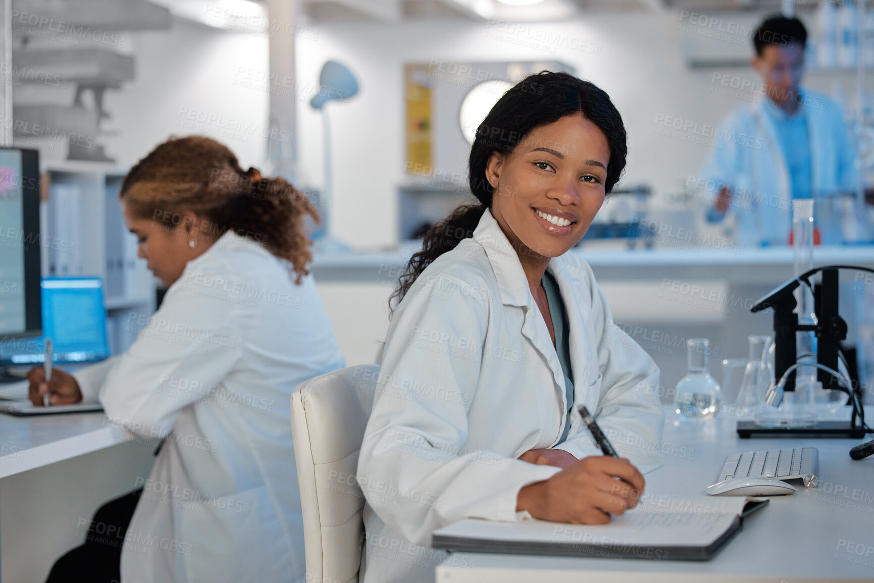 Buy stock photo Portrait, smile and woman in laboratory for science, healthcare and writing findings at table. Scientists, happy and tech in research facility for microbiology, vaccine development and chemistry