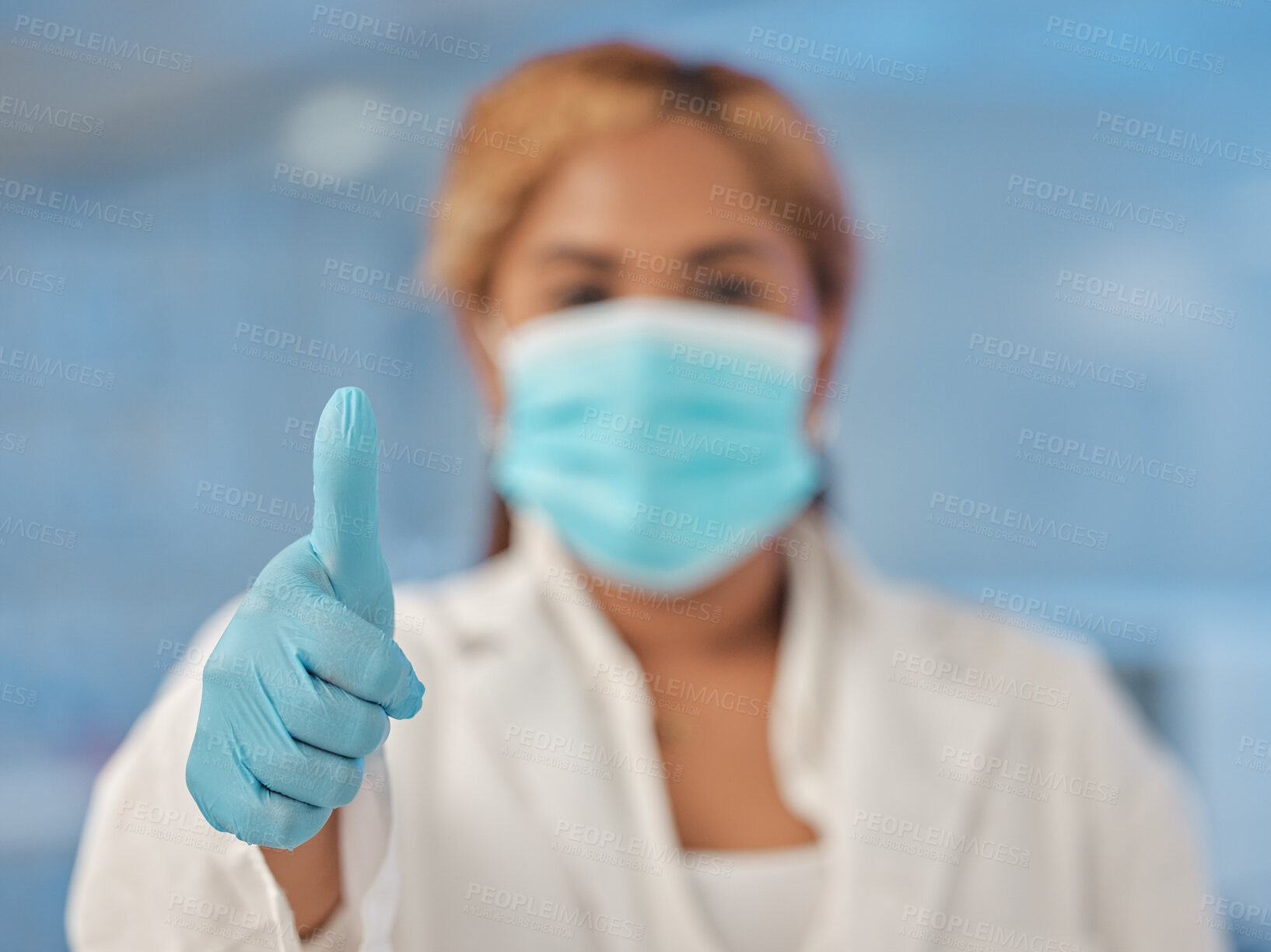 Buy stock photo Woman, doctor and portrait with thumbs up for medical safety, protection or healthcare review at hospital. Female person, surgeon or employee with like emoji, yes sign or ok for latex gloves and mask