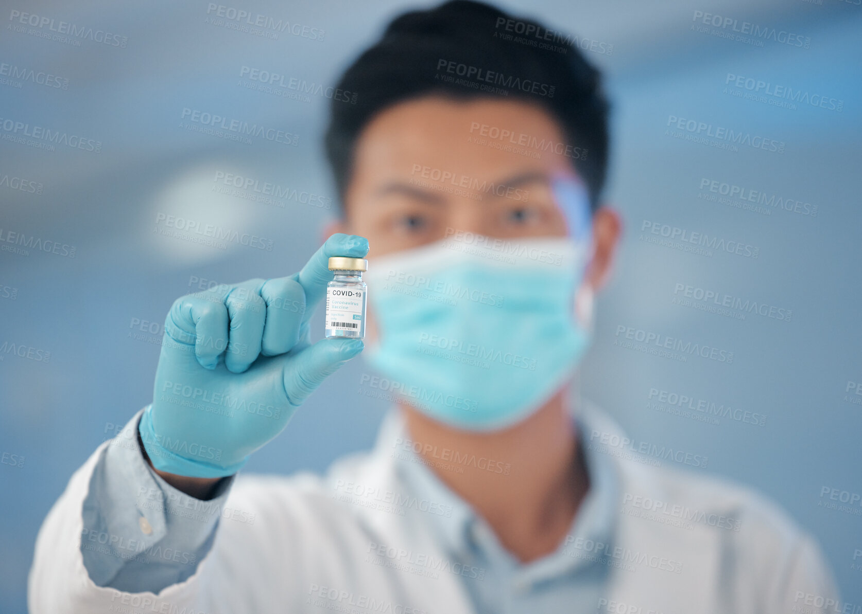 Buy stock photo Man, doctor and portrait with vial for vaccine, cure or medical solution at hospital. Male person, surgeon or employee with bottle, gloves or mask for antibiotic, new drug or covid vaccination