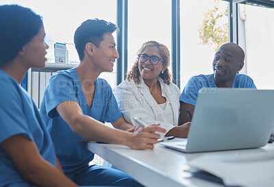Buy stock photo Cropped shot of a group a medical professionals sitting in the hospital boardroom during a meeting