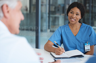 Buy stock photo Cropped shot of an attractive young female nurse sitting in the hospital boardroom during a meeting