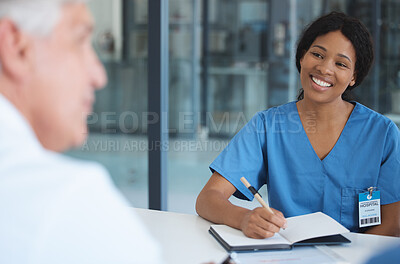 Buy stock photo Cropped shot of an attractive young female nurse sitting in the hospital boardroom during a meeting
