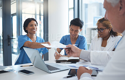 Buy stock photo Cropped shot of a group a medical professionals sitting in the hospital boardroom during a meeting