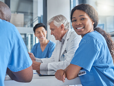 Buy stock photo Cropped portrait of an attractive young female nurse sitting in the hospital boardroom during a meeting