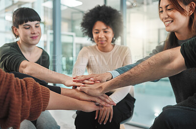 Buy stock photo Shot of people stacking their hands during a group therapy session