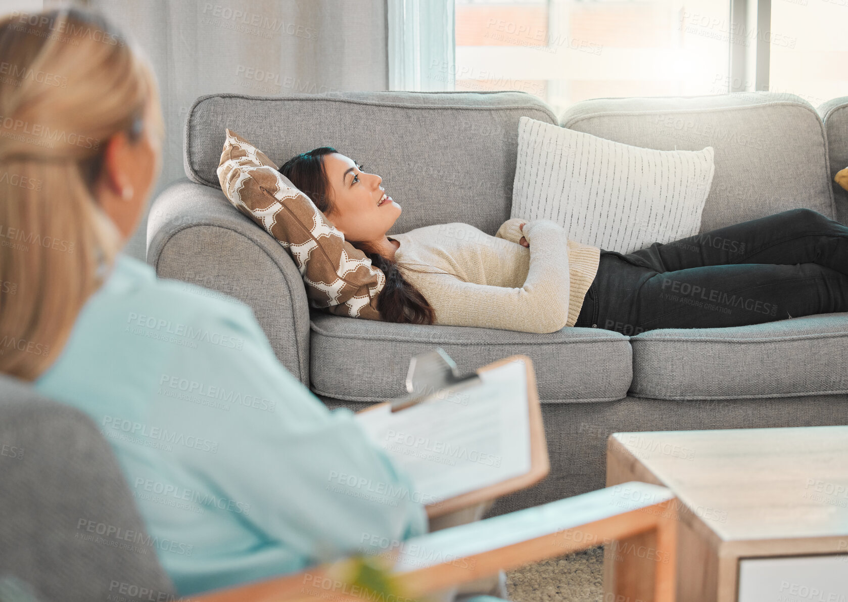 Buy stock photo Counseling, woman and therapist on couch for consultation, mental health or anxiety support in office. Therapy, female patient or psychologist on sofa for discussion, share trauma or story in session