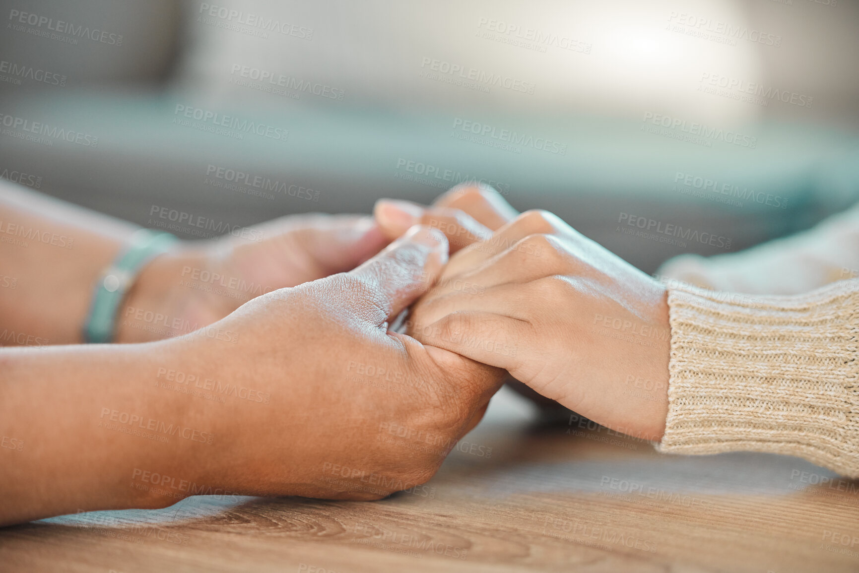 Buy stock photo Empathy, people and holding hands for support at table with compassion, sharing trauma or console. Sympathy, therapist and helping patient in counselling for mental health, psychotherapy or treatment