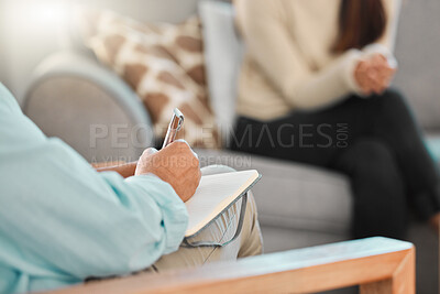 Buy stock photo Cropped shot of a psychologist making notes during a consultation