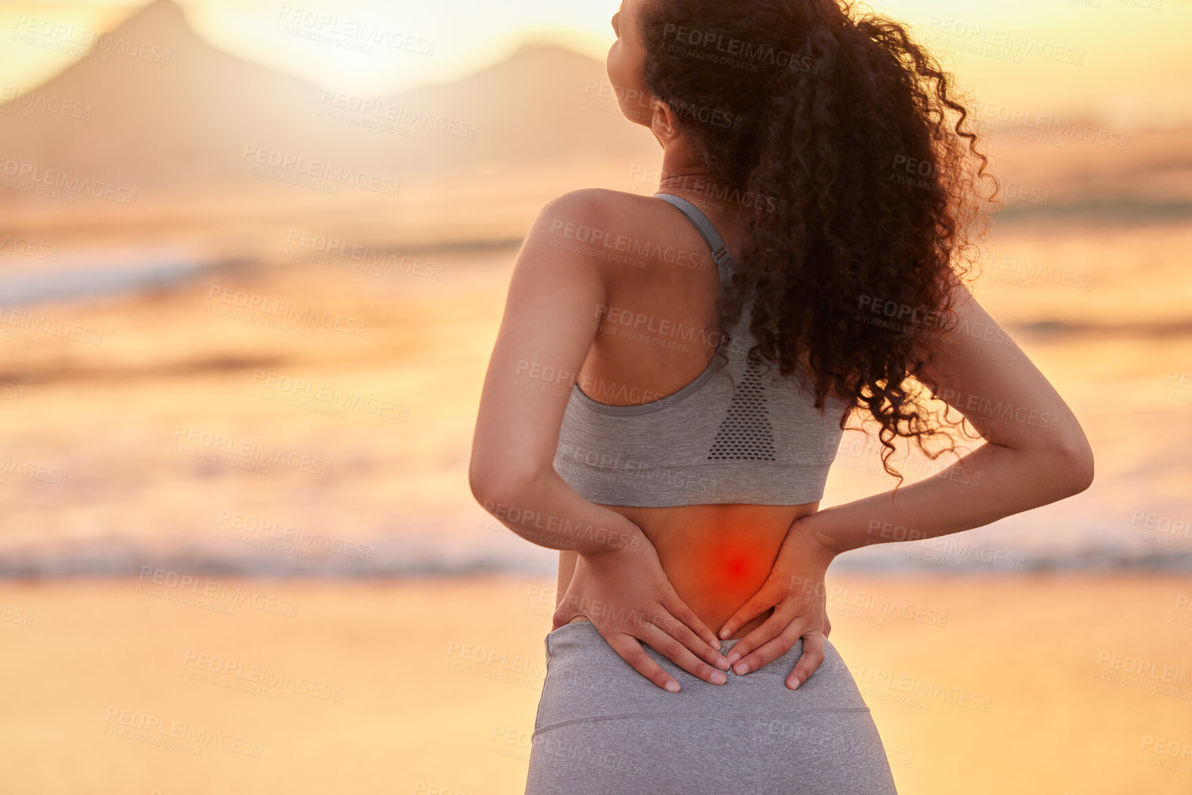 Buy stock photo Woman, fitness and back pain with red glow on beach sunset for accident, injury or muscle tension. Female person, athlete or runner with sore spine, inflammation or ache in sprain, pressure or strain