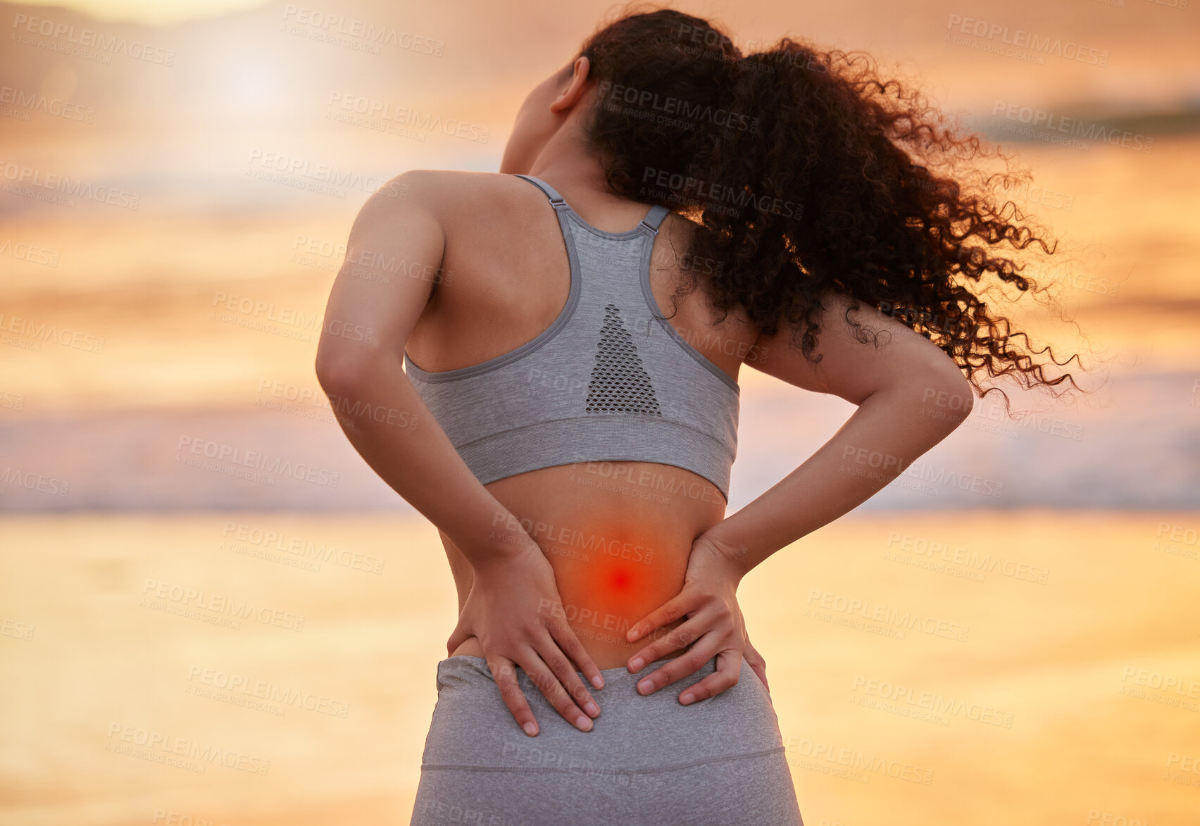 Buy stock photo Woman, fitness and back pain with inflammation on beach sunset for accident, injury or muscle tension. Female person, athlete or runner with sore spine, red glow or ache in sprain, pressure or strain