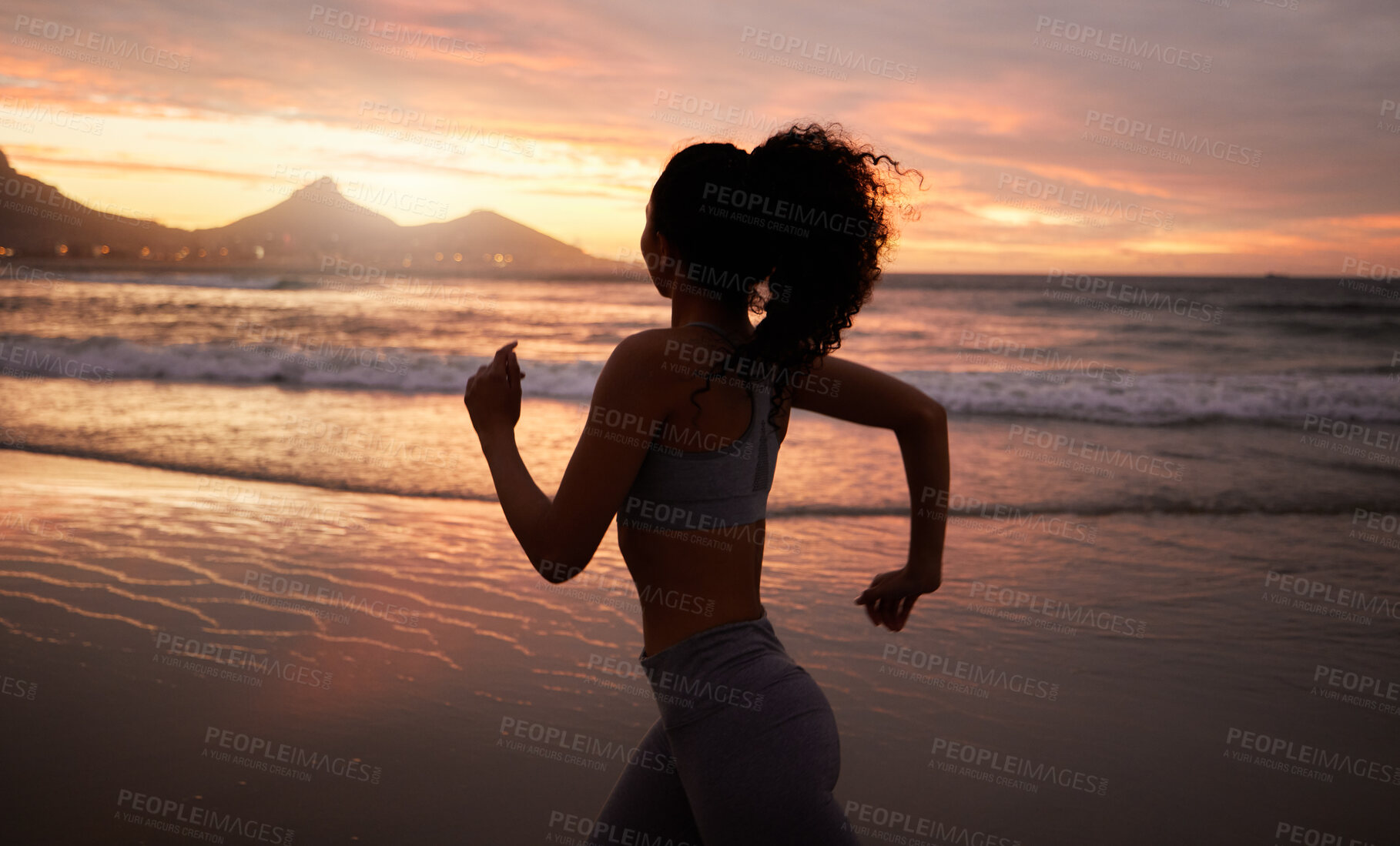 Buy stock photo Woman, running and fitness at beach, sunset and speed for training, wellness and adventure in nature. Person, girl and silhouette at dusk for exercise, fast and workout with health by ocean in Brazil