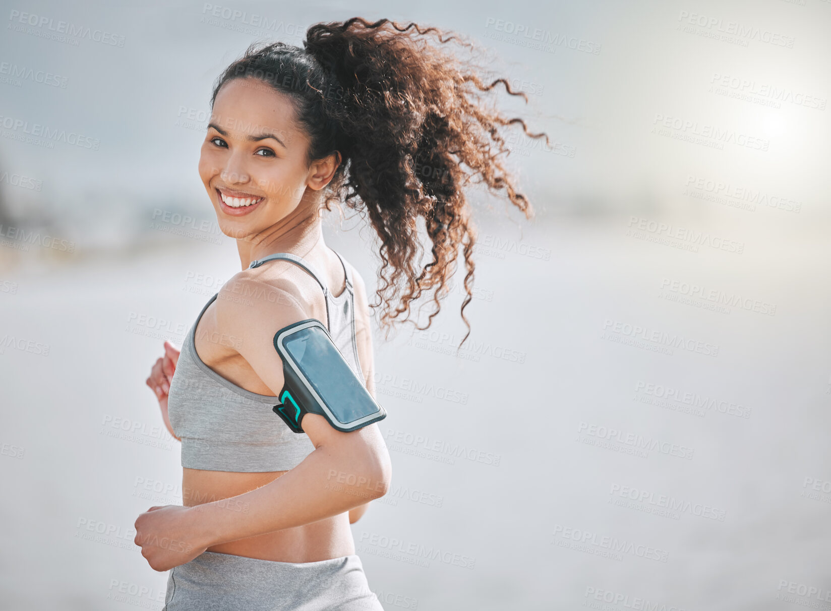 Buy stock photo Happy, running and portrait of woman on beach for exercise, marathon training and cardio workout. Sports, athlete and person in nature for performance, endurance and fitness for wellness or health