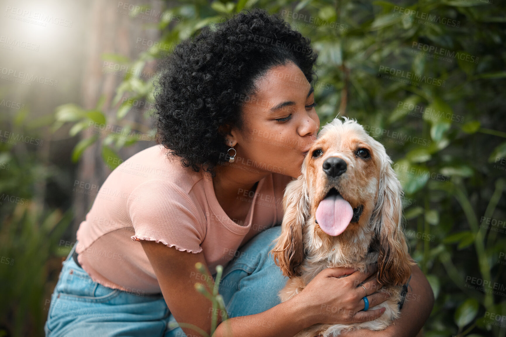 Buy stock photo Woman, cocker spaniel puppy and kiss in park with smile, hug and care on ground in summer. Girl, dog mom and happy for embrace with pet, animal or connection with love on path with sunshine in nature