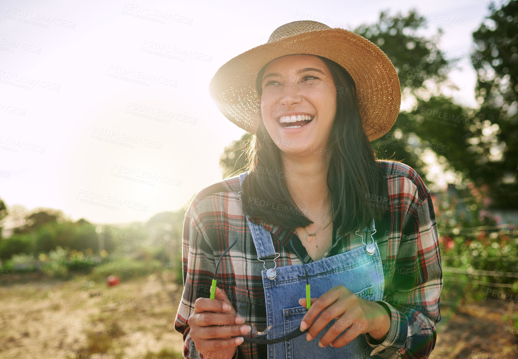 Buy stock photo Shot of a female farmer stand on a farm