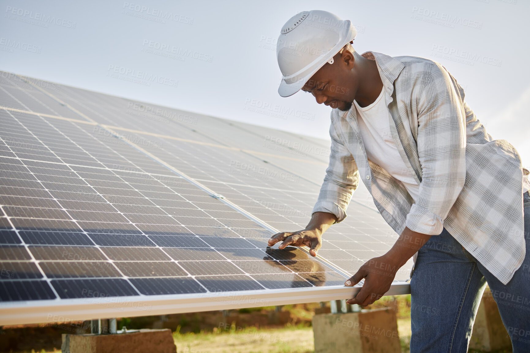 Buy stock photo Black man, solar panel and renewable energy for connection, sustainable or clean power. Engineer, alternative generator and carbon neutral technology in conservation, environment or green electricity