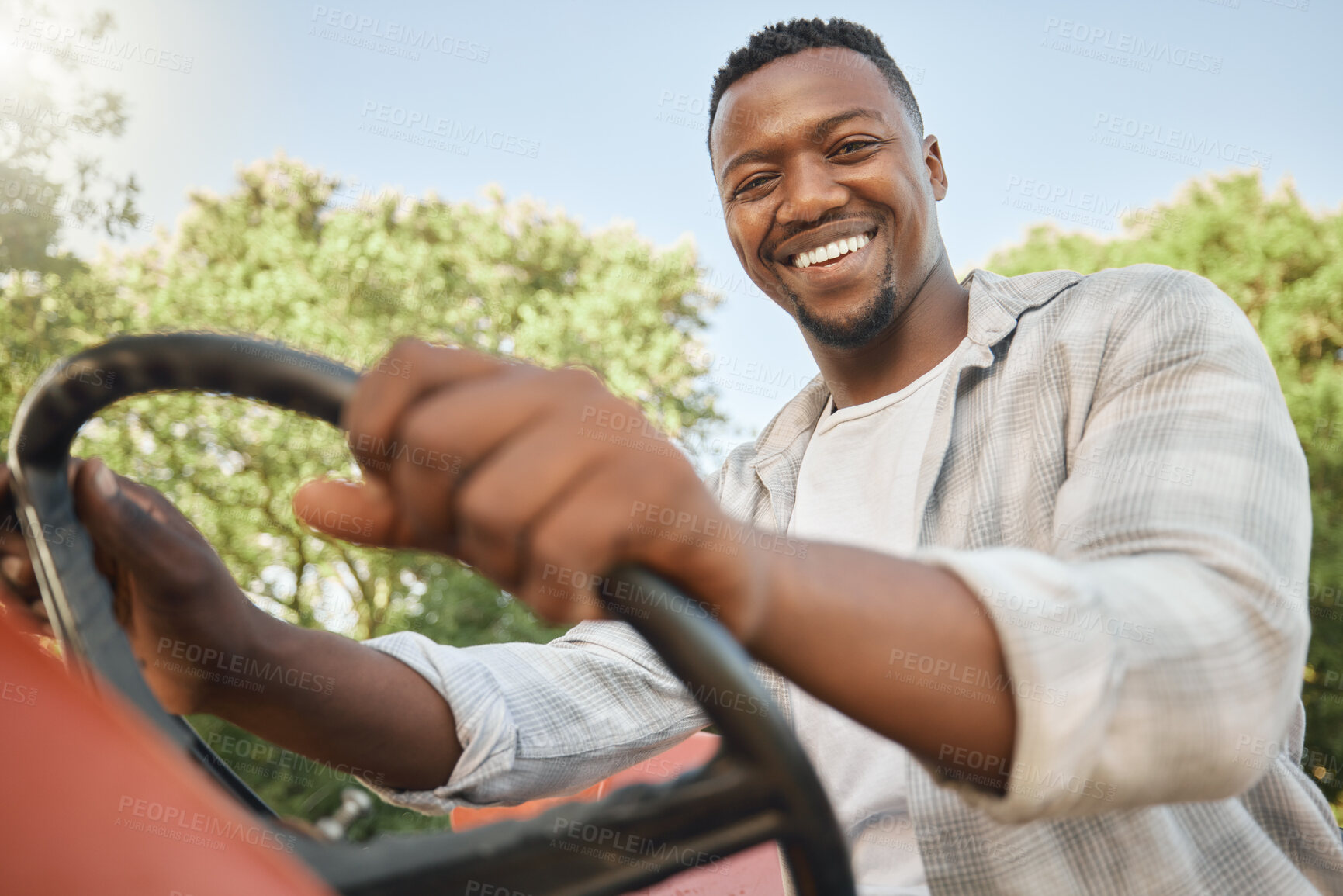 Buy stock photo Agriculture, tractor and portrait with black man for quality inspection, sustainability and growth. Smile, farm and plant with person in Kenya countryside for food security, ecology and environment