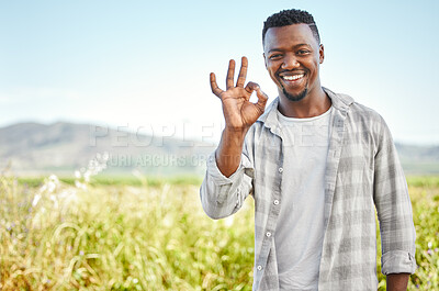 Buy stock photo Cropped shot of a handsome young man working on his farm