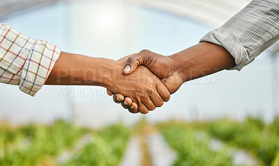 Buy stock photo Cropped shot of two unrecognizable people shaking hands on a farm