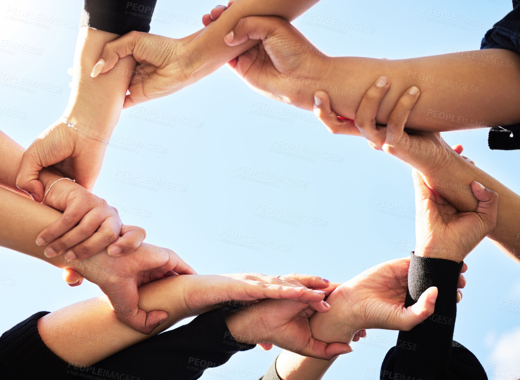 Buy stock photo Below, team and hands in circle for support, strength and unity for synergy. Group, huddle or people connected for power, solidarity or trust in community for protest, empowerment or organization