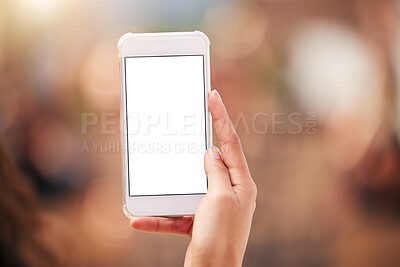 Buy stock photo Shot of a protester holding their smartphone during a rally