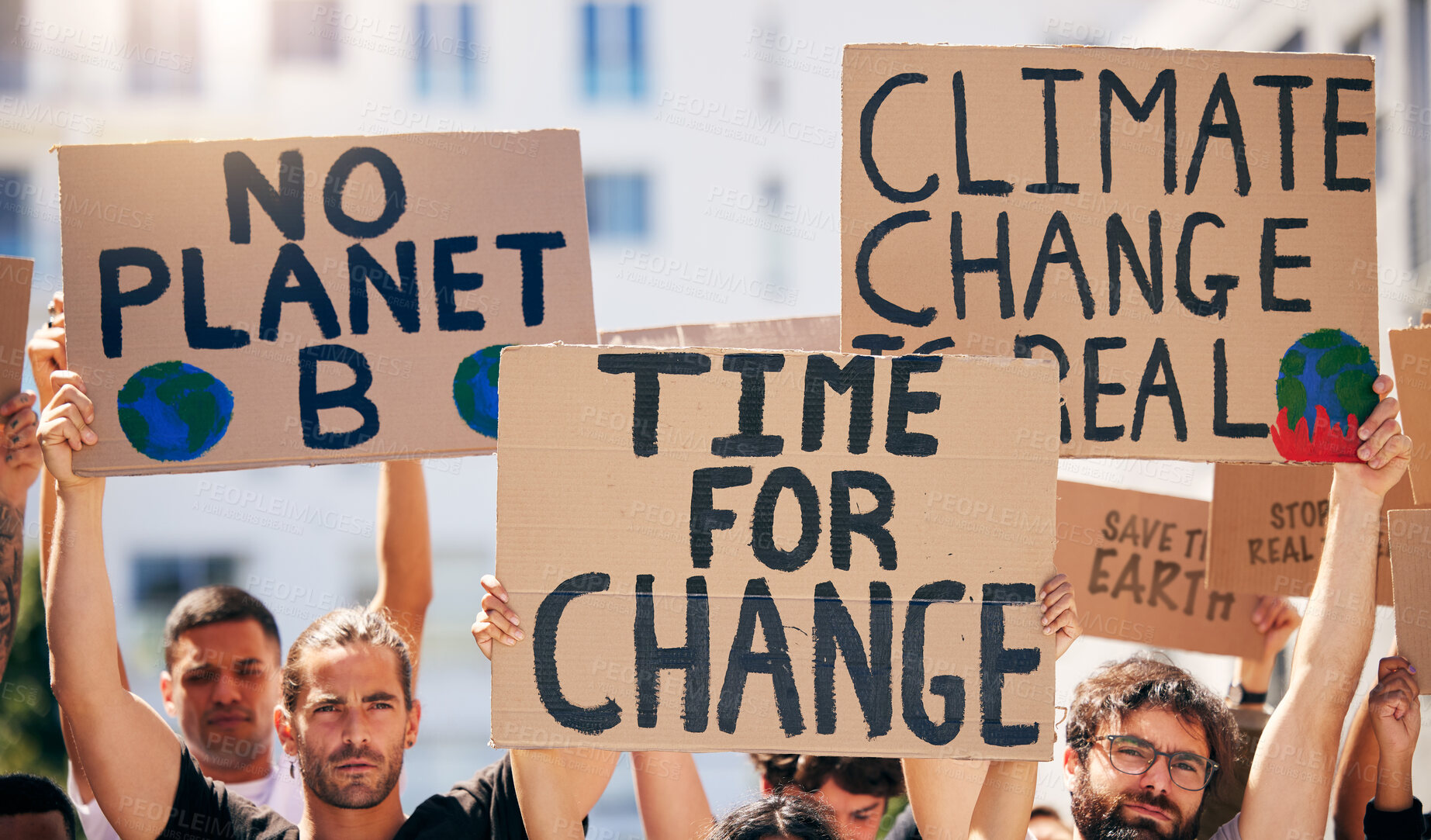 Buy stock photo Group, poster and together in street for planet, climate change and sustainable future in city. People, cardboard sign and activism for change, sustainability or justice for environment in metro road