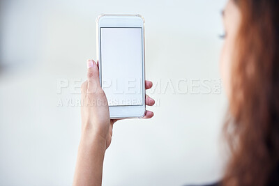 Buy stock photo Closeup shot of an unrecognisable woman holding a cellphone with a blank screen
