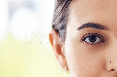 Buy stock photo Closeup shot of a young woman staring ahead of her