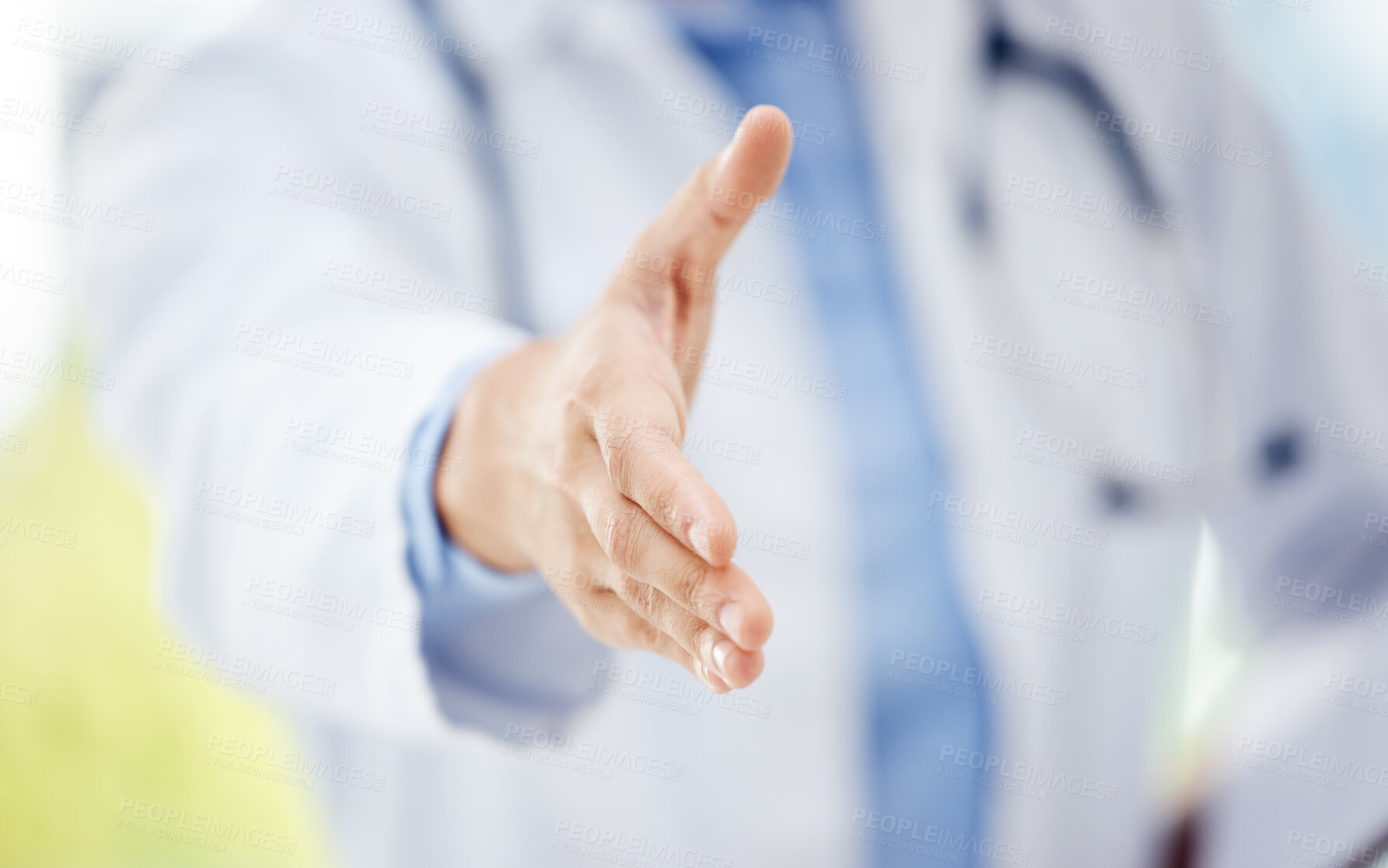 Buy stock photo Closeup shot of an unrecognisable doctor extending a handshake in a hospital