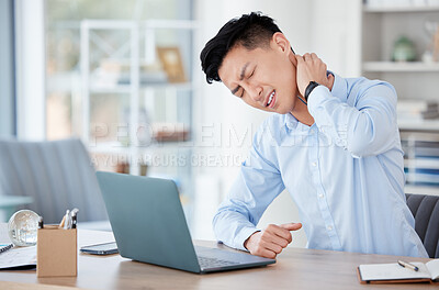 Buy stock photo Shot of a young businessman suffering from neck pain at work