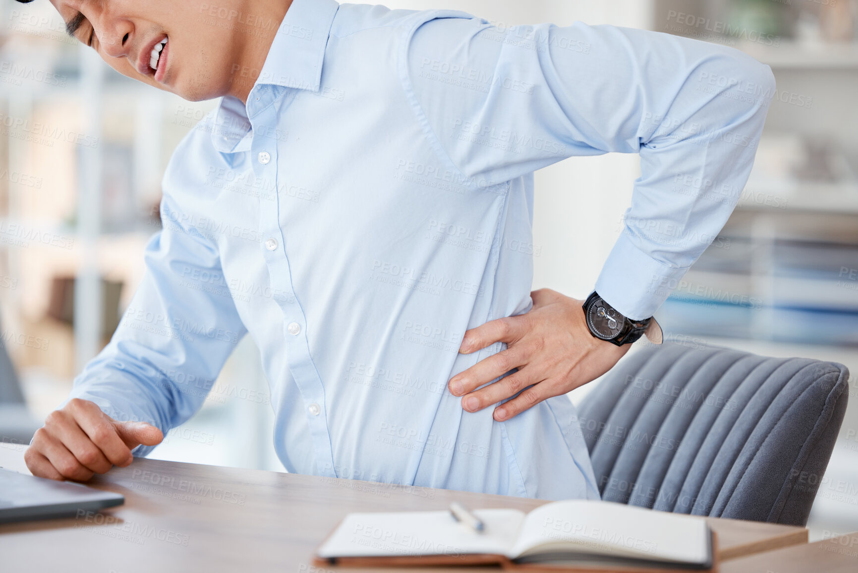 Buy stock photo Business, man and back pain from injury in office with muscle tension, bad posture and strain at workplace. Professional, employee and stress for spine inflammation, burnout and discomfort at desk