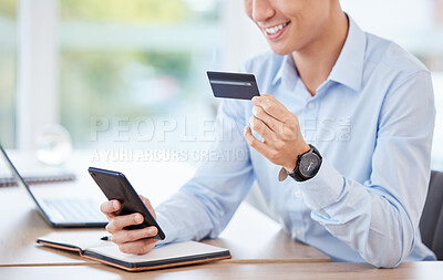 Buy stock photo Shot of an unrecognizable businessperson using a phone and credit card at work