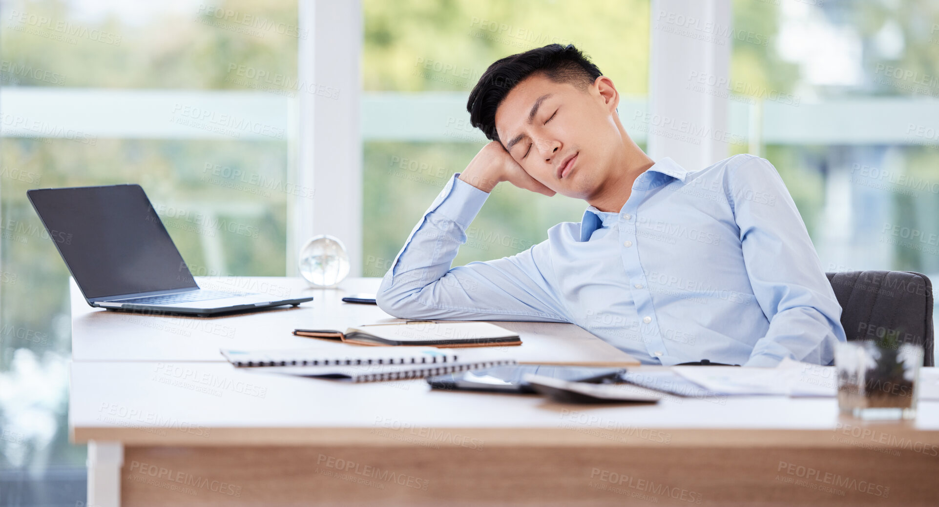 Buy stock photo Sleeping, tired and Asian man in office with burnout, insomnia and overwork on business laptop. Relax, resting and employee with fatigue, exhausted and stress with boredom or low energy with deadline