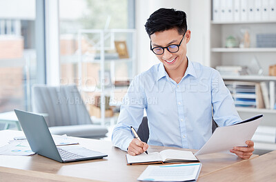 Buy stock photo Businessman, happy and desk with stock market in office for book, investment and growth of revenue. Asian broker, tech and writing with documents for profit report, valuation and feedback of equity