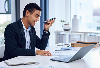 Buy stock photo Shot of a young businessman using a cellphone while going through paperwork in an office