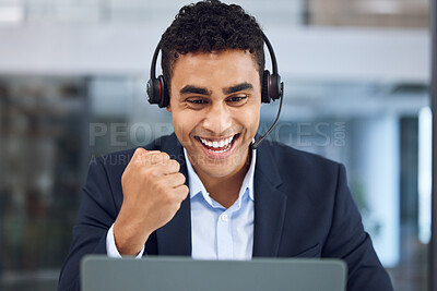 Buy stock photo Shot of a young call centre agent cheering while working in an office