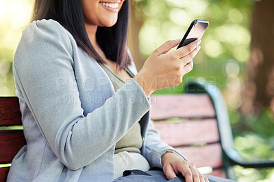 Buy stock photo Nature, mobile and business woman on bench for communication, browsing internet or social media on lunch break. Outdoor, online and person for networking, texting or reading latest news in park