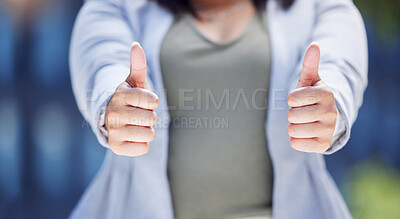 Buy stock photo Closeup shot of an unrecognisable businesswoman showing thumbs up in the city