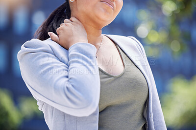 Buy stock photo Closeup shot of an unrecognisable businesswoman experiencing neck pain in the city