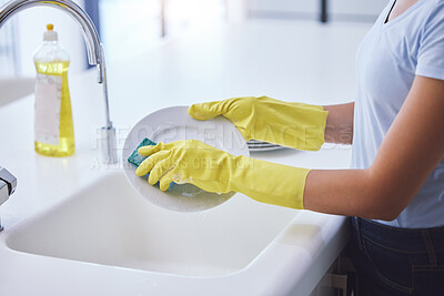 Buy stock photo Shot of an unrecognizable woman cleaning the kitchen at home