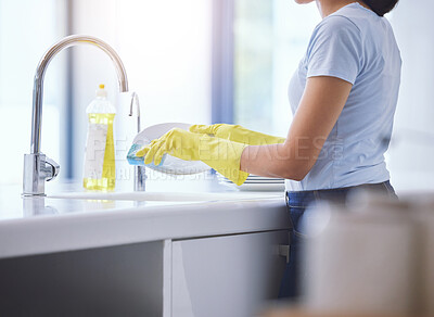 Buy stock photo Shot of an unrecognizable woman cleaning the kitchen at home