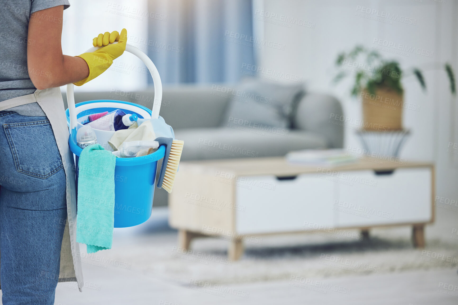 Buy stock photo Shot of an unrecognizable person preparing to clean at home