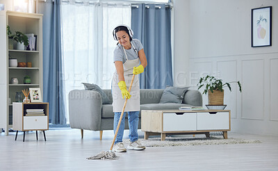 Buy stock photo Service, mopping and woman with headphones in living room for cleaning, remove dirt or disinfection. Floor, gloves and hispanic maid with apron for listening to music, podcast or hygiene in home