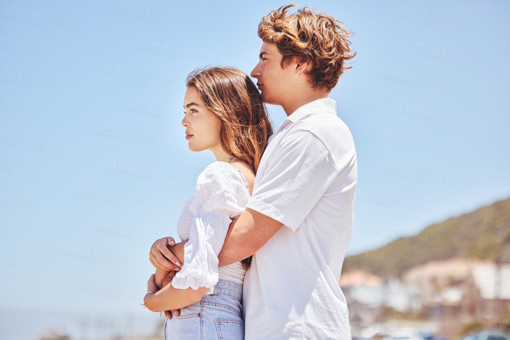 Buy stock photo Hug, love and couple at beach to relax for bonding, loving relationship and together by ocean. Dating, travel and man and woman embrace for affection and romance on holiday, vacation and weekend