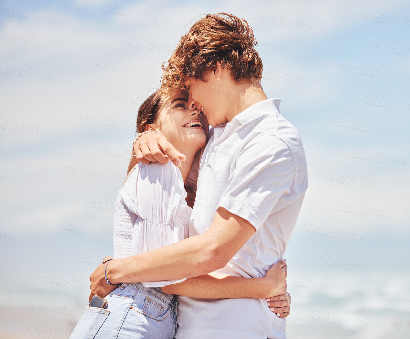 Buy stock photo Hug, happy and couple at beach to relax for bonding, loving relationship and together by ocean. Dating, travel and man and woman embrace for affection and romance on holiday, vacation and weekend