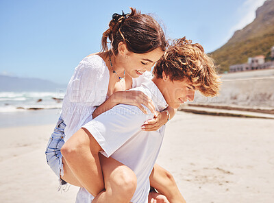 Buy stock photo Piggy back, happy and couple at beach to relax for bonding, loving relationship and fun by ocean. Dating, travel and man and woman on romantic holiday, vacation and playful on weekend together