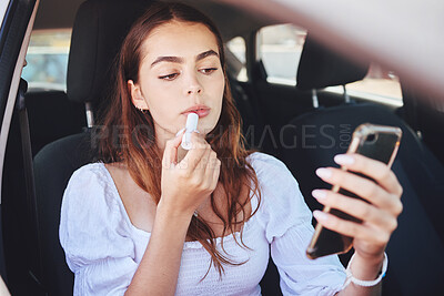 Buy stock photo Car, woman and applying lipstick with smartphone for beauty, aesthetics and makeup for romantic date. Female person, lifestyle and confident on vehicle for traveling or commuting to event or function