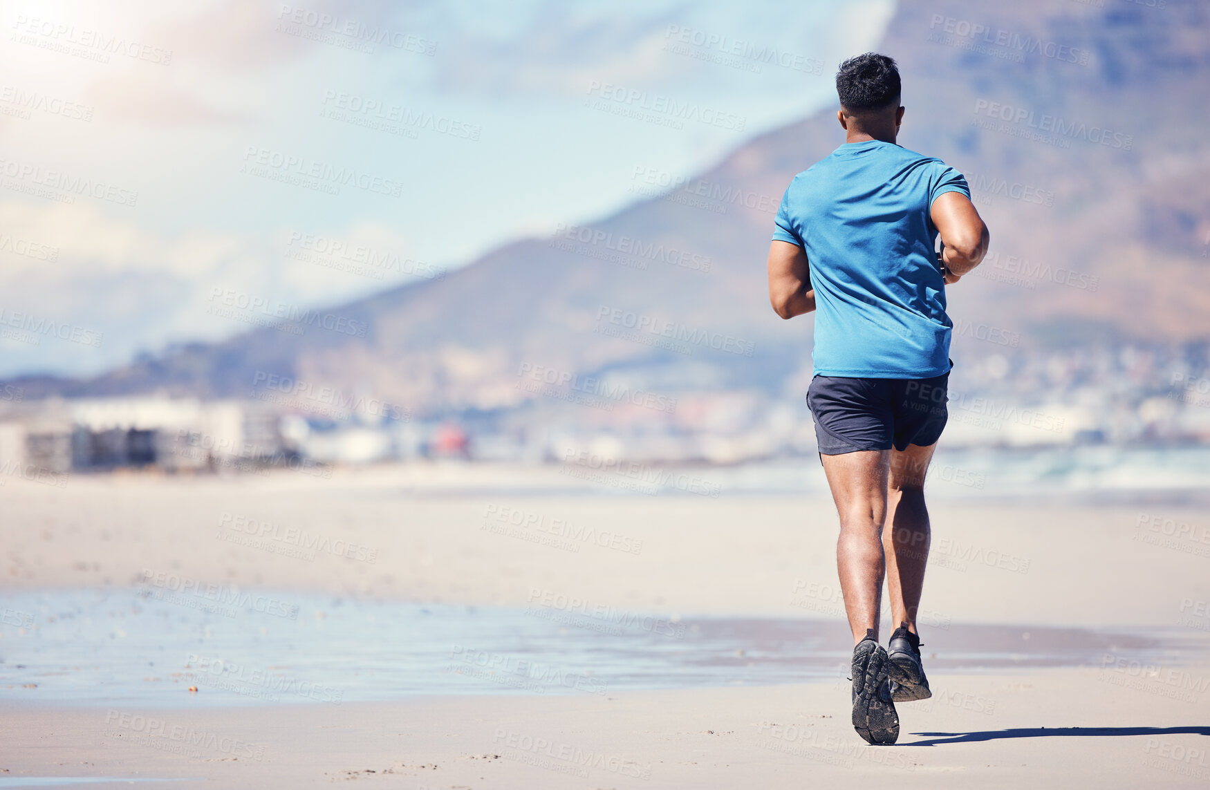 Buy stock photo Man, back and running on beach for fitness or daily physical cardio, active workout and exercise session for health. Male person, outdoor and jogging or training on coastline, athletic and fit.