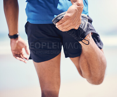 Buy stock photo Shot of a man stretching during his workout at the beach