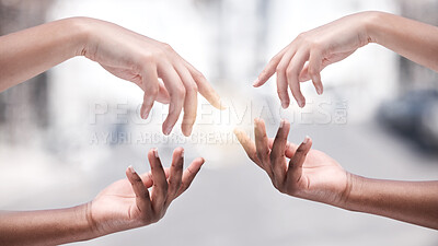 Buy stock photo Shot of two protestors reaching for one another during a rally